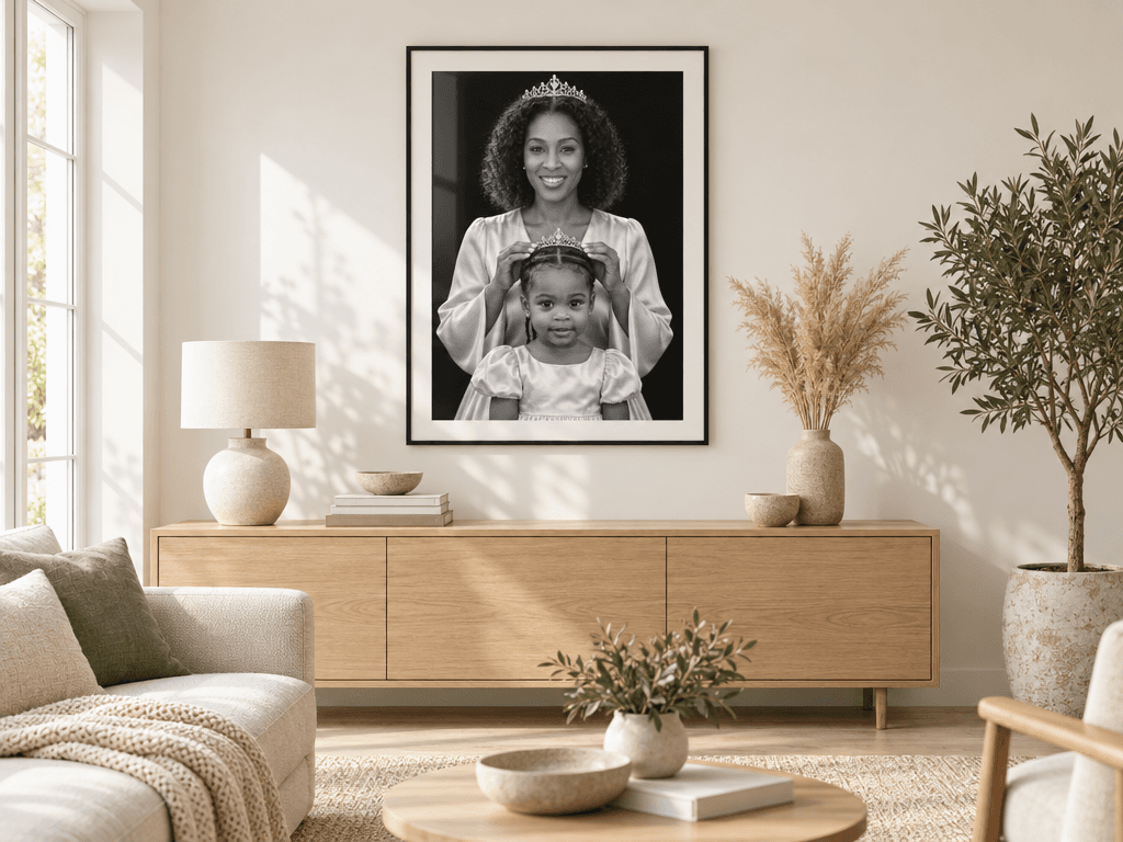 A stylish living room with a framed family portrait hanging on a pale wall above a sofa, no people in the room